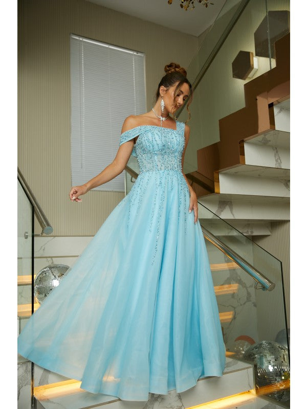 Close-up of the beaded bodice and scoop neck of the organza gown.