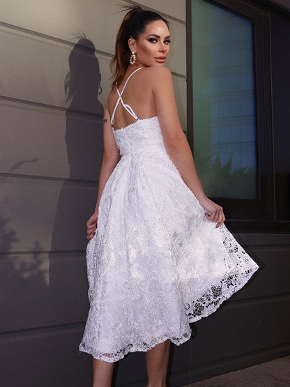 Close-up of lace and ruffle details on sweetheart neckline dress.