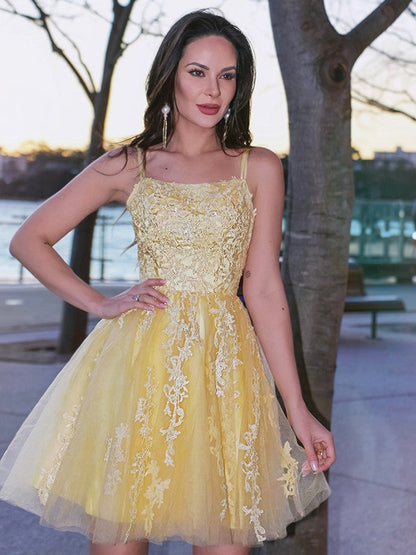 Front view of aqua blue A-line homecoming dress with delicate applique.