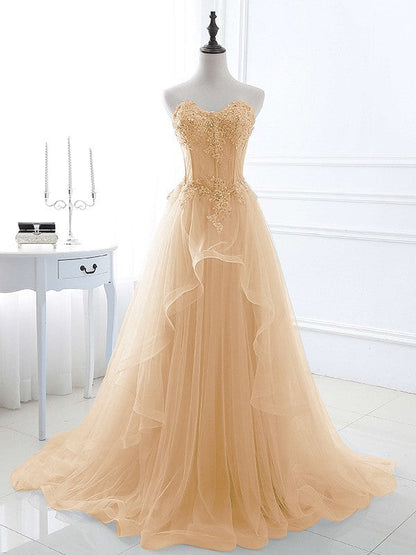 Champagne A-Line Princess dress featuring delicate appliques.