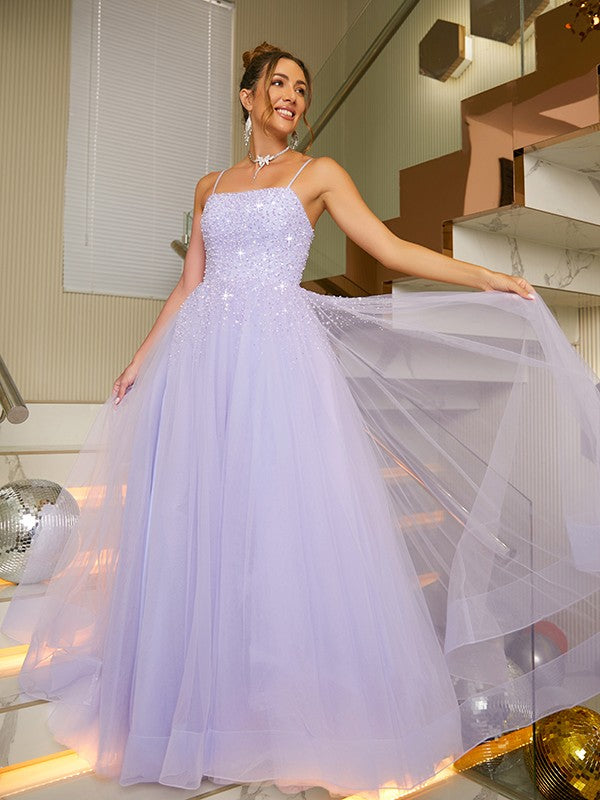 Close-up of delicate beading and spaghetti straps on the A-line princess dress.