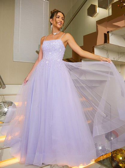 Close-up of delicate beading and spaghetti straps on the A-line princess dress.