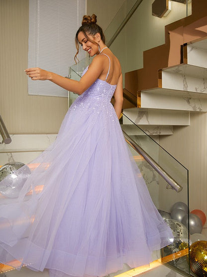 Side view of the elegant A-line princess tulle gown, highlighting its silhouette.