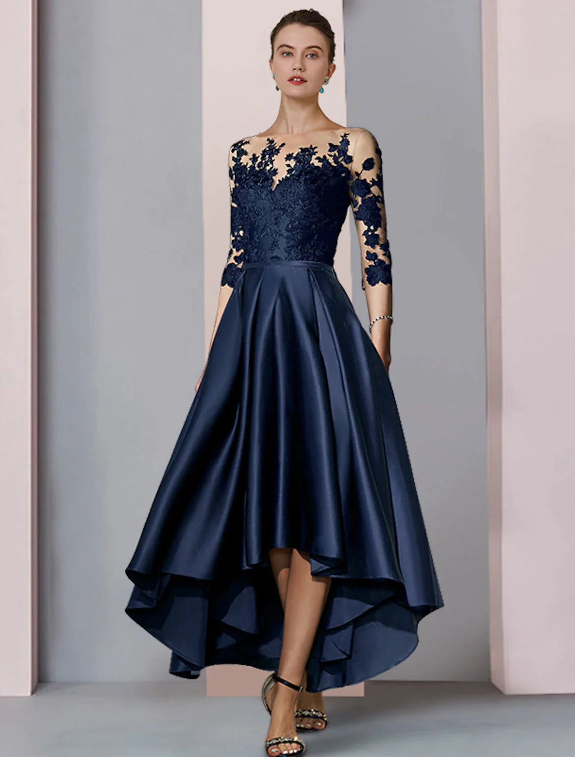 Back view of the high-low satin lace gown, showing asymmetrical hem.