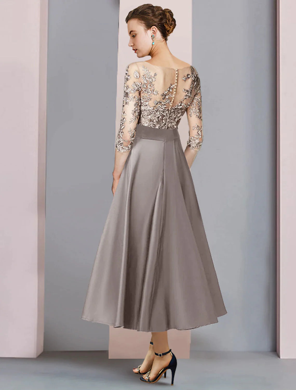 Side view of satin lace A-line dress featuring delicate appliques and bow details.