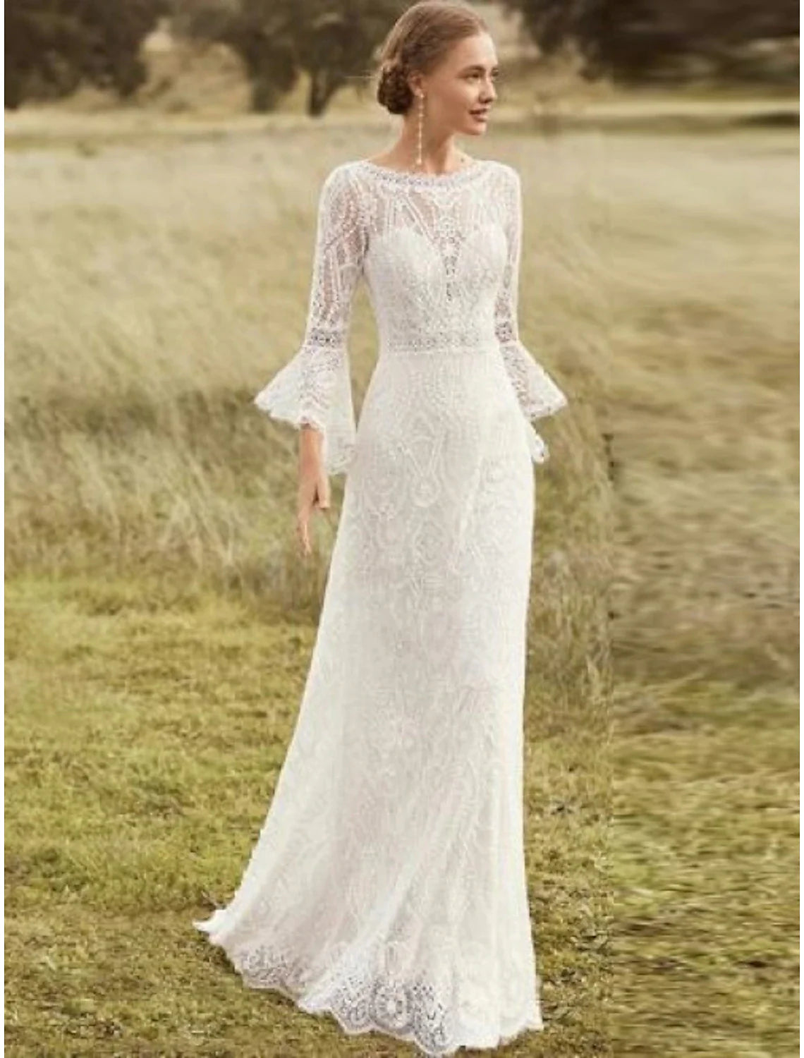 A-line boho wedding dress with long lace sleeves and scoop neck.