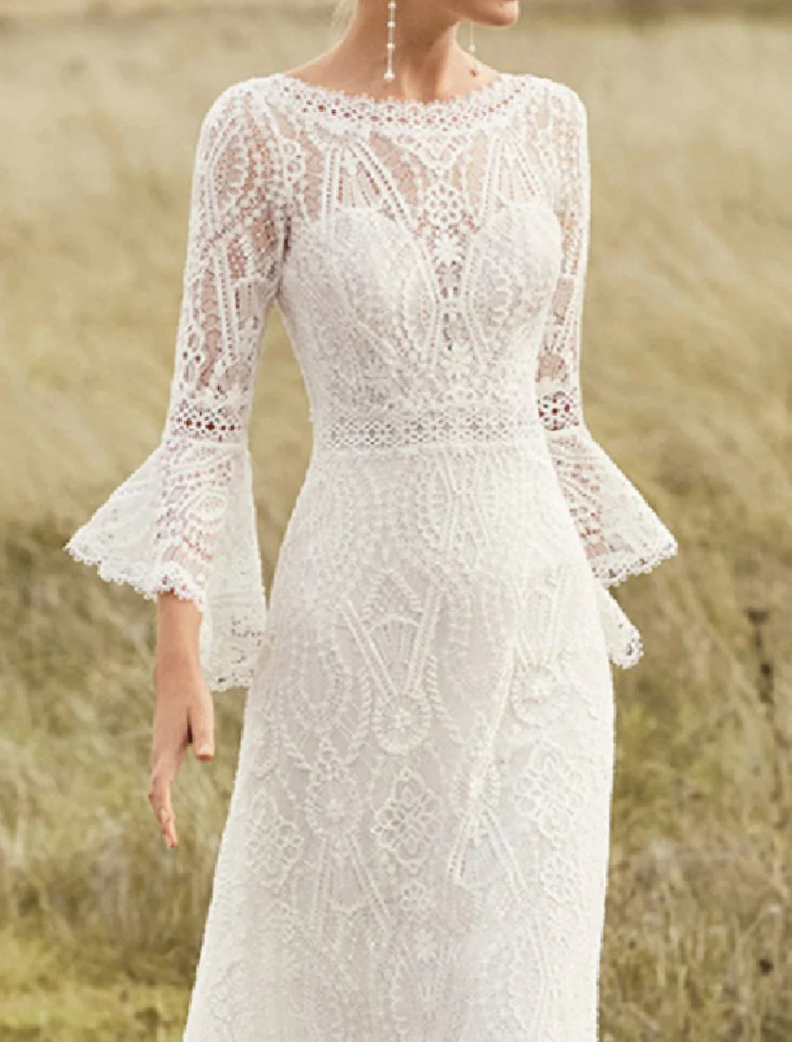 Side profile of the bride wearing the A-line lace wedding dress.