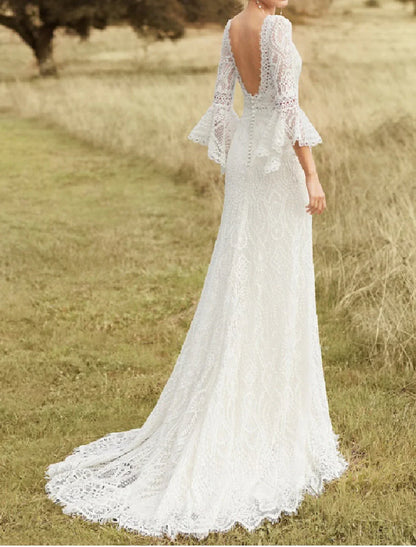 Full length view of the boho lace wedding dress with a sweep train.