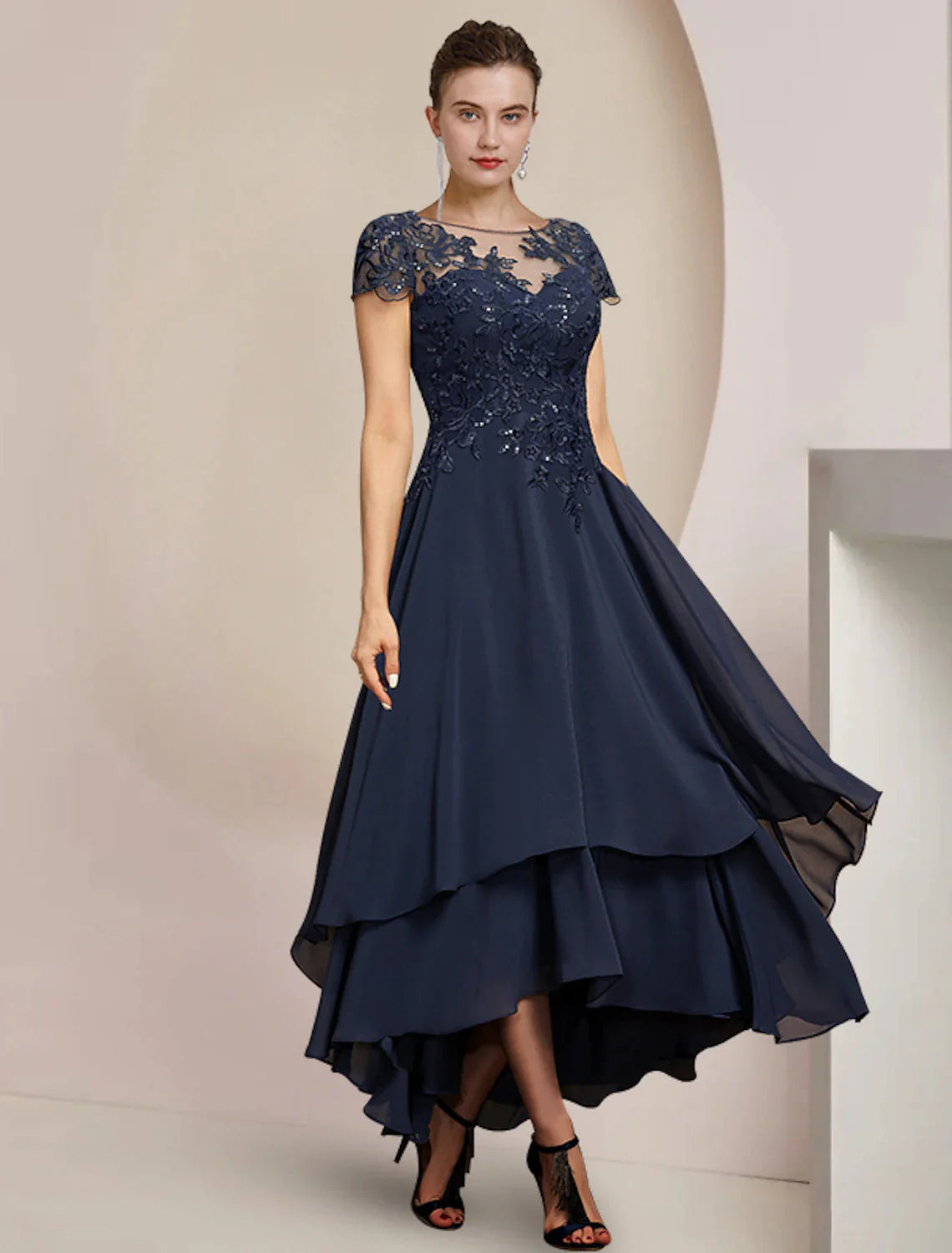 Elegant A-Line Mother of the Bride dress in navy with scoop neck and short sleeves.