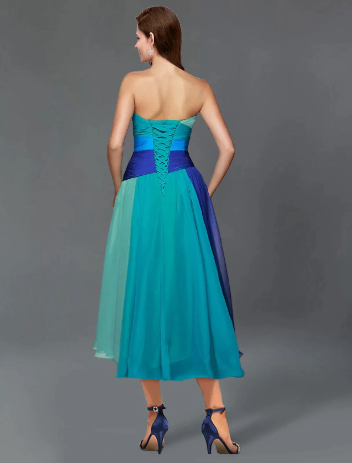 Back view of the A-line color block tea length dress, highlighting the ruched chiffon and short sleeves.
