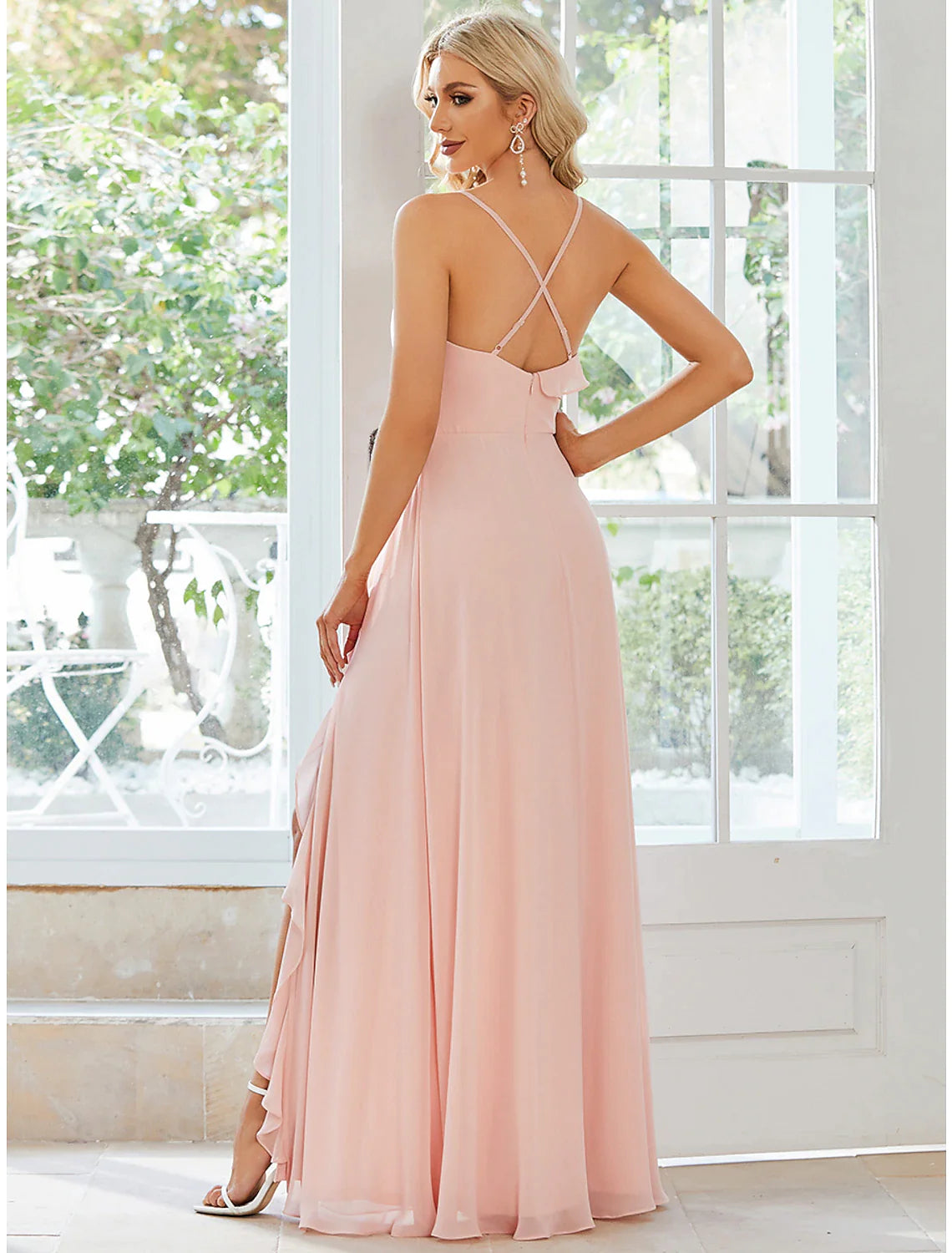 Model gracefully posing in the floor-length A-line chiffon dress.