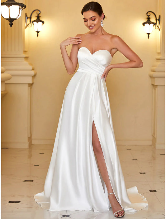 Model wearing an elegant A-line strapless satin evening gown, front view.