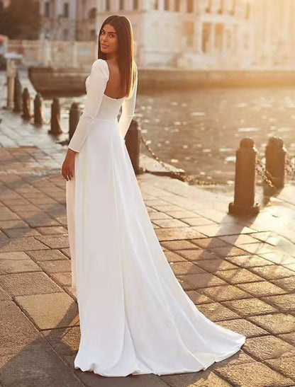 Back view of the A-line satin wedding dress, showing the sweep train.