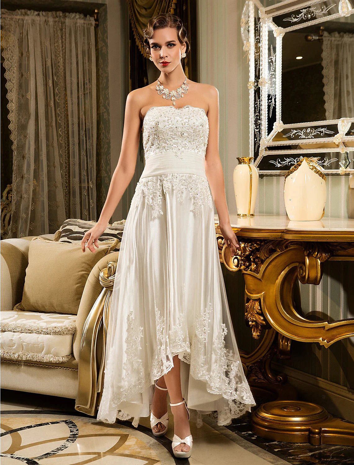 Full view of an elegant A-line white wedding dress with sweetheart neckline and lace appliques.
