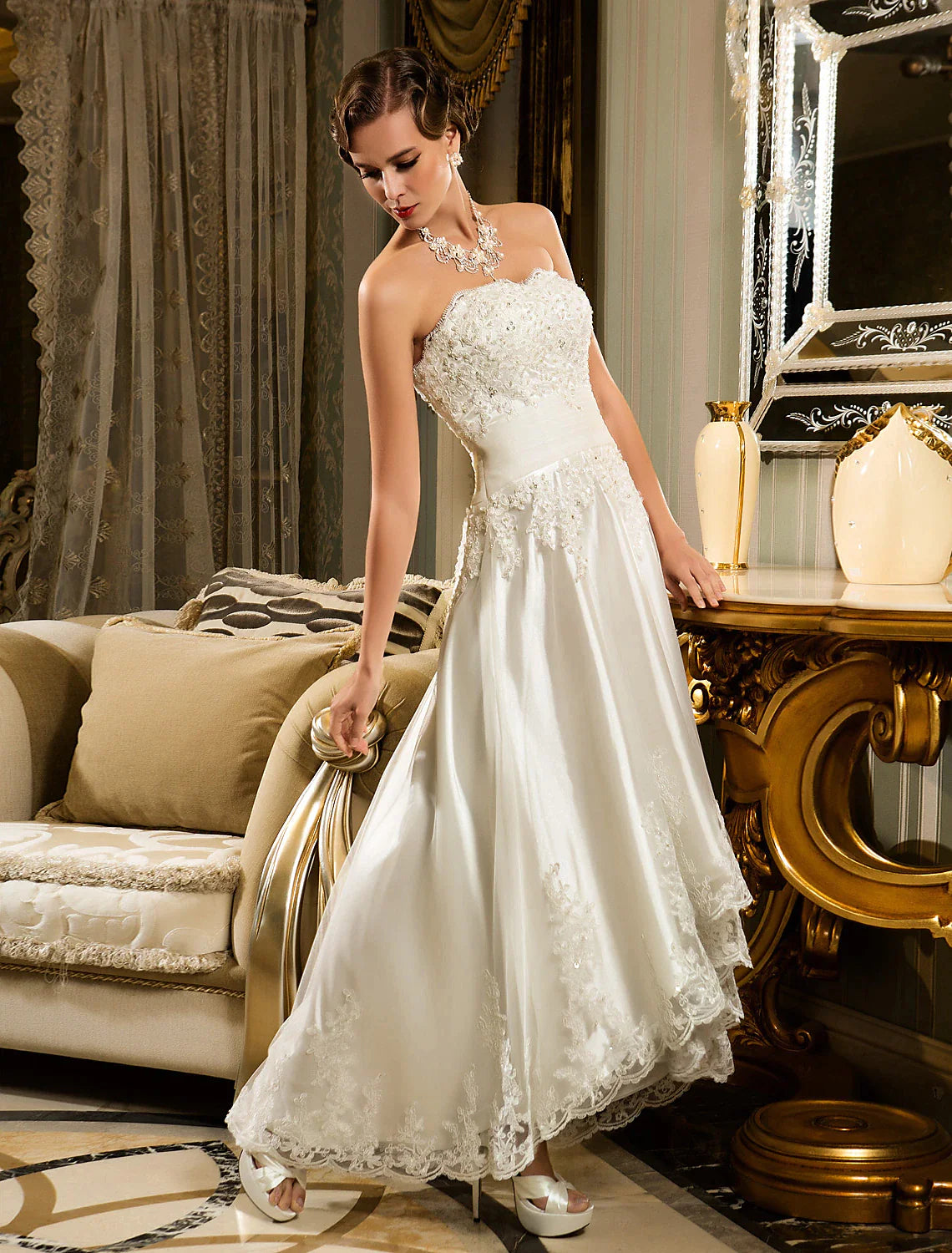 Full length view of the white wedding dress, showcasing its elegant silhouette and details.