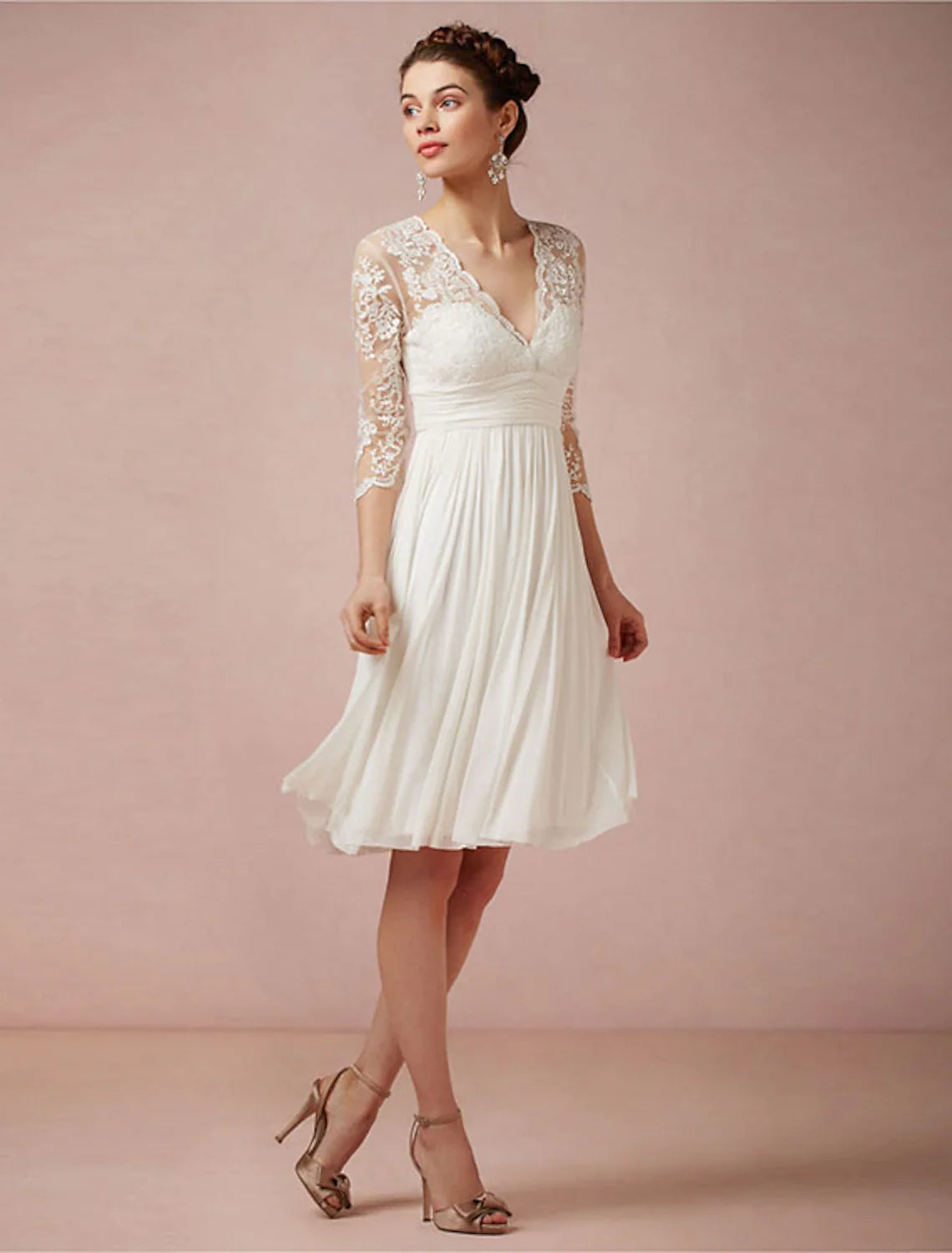 Model wearing a white A-line V-neck reception dress with 3/4 sleeves and ruched details.