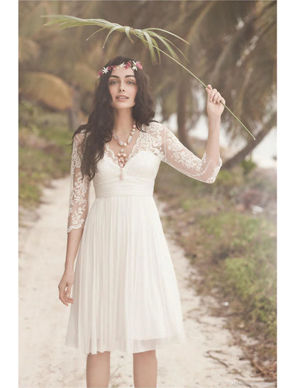 Back view of a model in a white knee-length A-line dress featuring an open back and 3/4 sleeves.