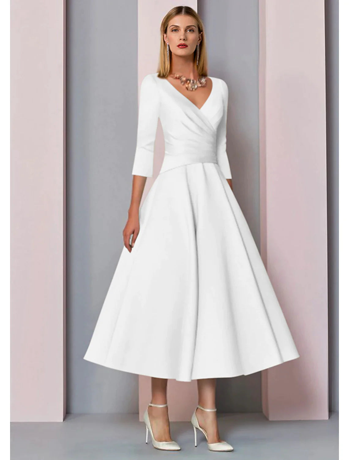 Side profile of a model wearing the pleated A-line V-neck satin dress.