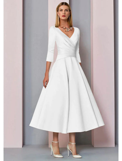 Side profile of a model wearing the pleated A-line V-neck satin dress.