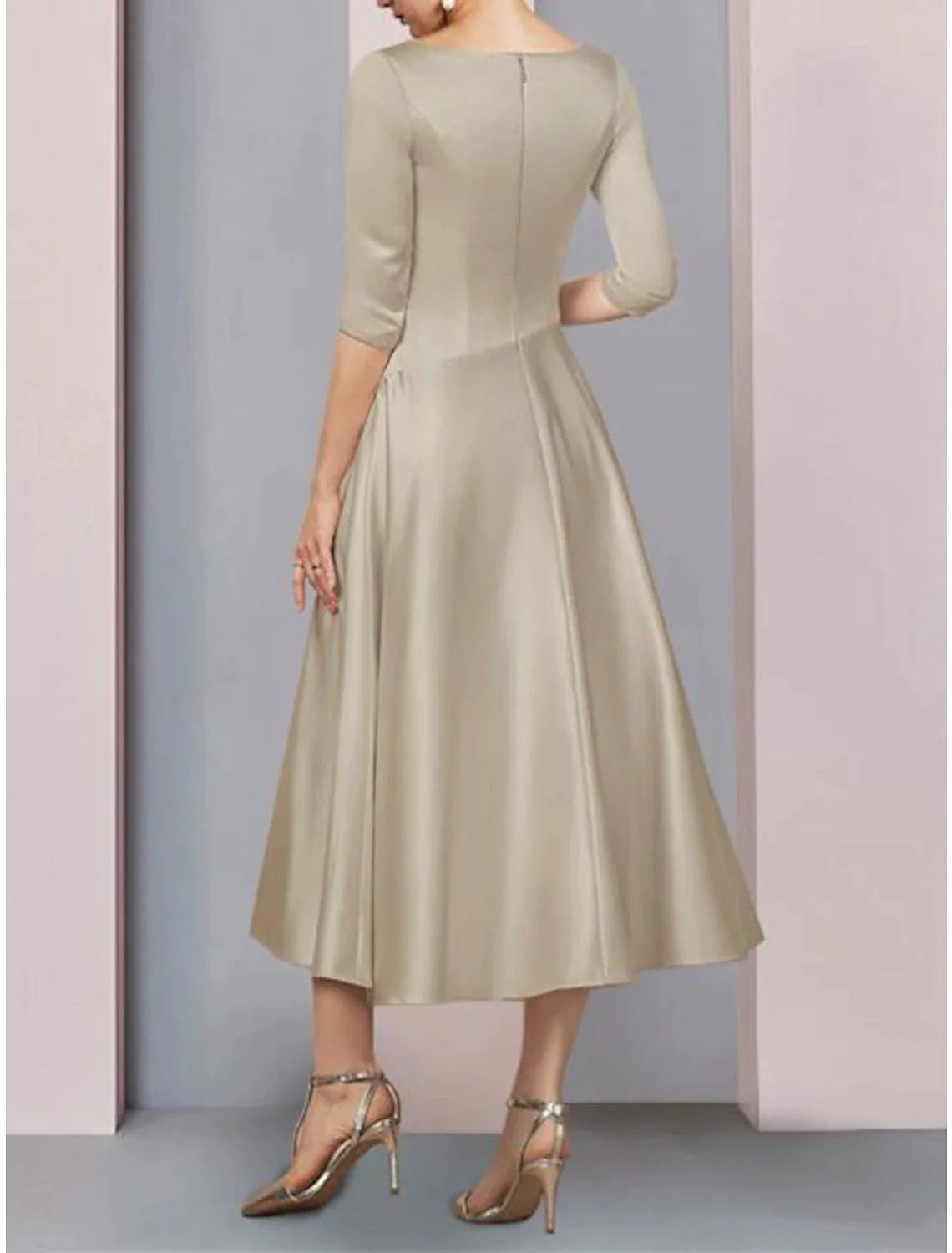 Full length view of the A-line satin dress with pleats and 3/4 sleeves.