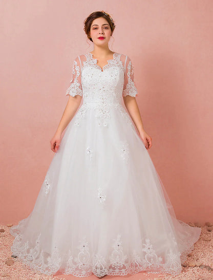 Model wearing an elegant A-Line V-neck half sleeve satin wedding dress with a cathedral train.