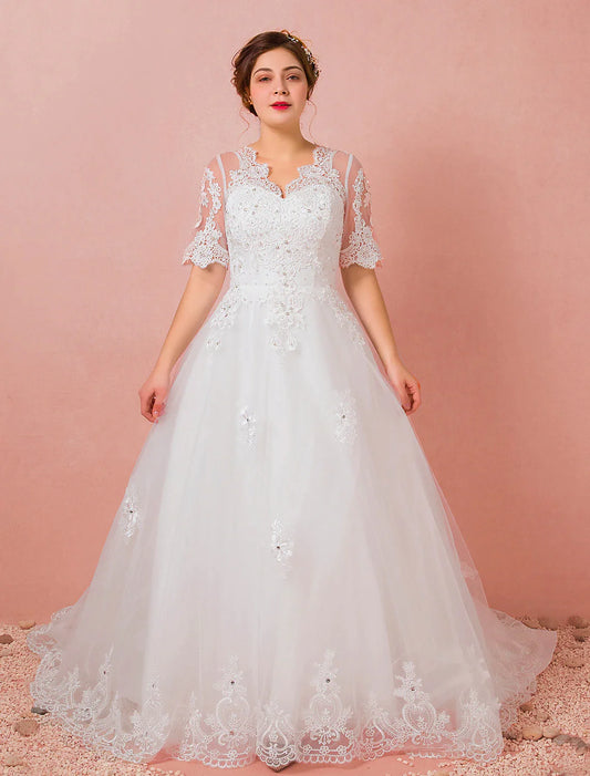 Model wearing an elegant A-Line V-neck half sleeve satin wedding dress with a cathedral train.