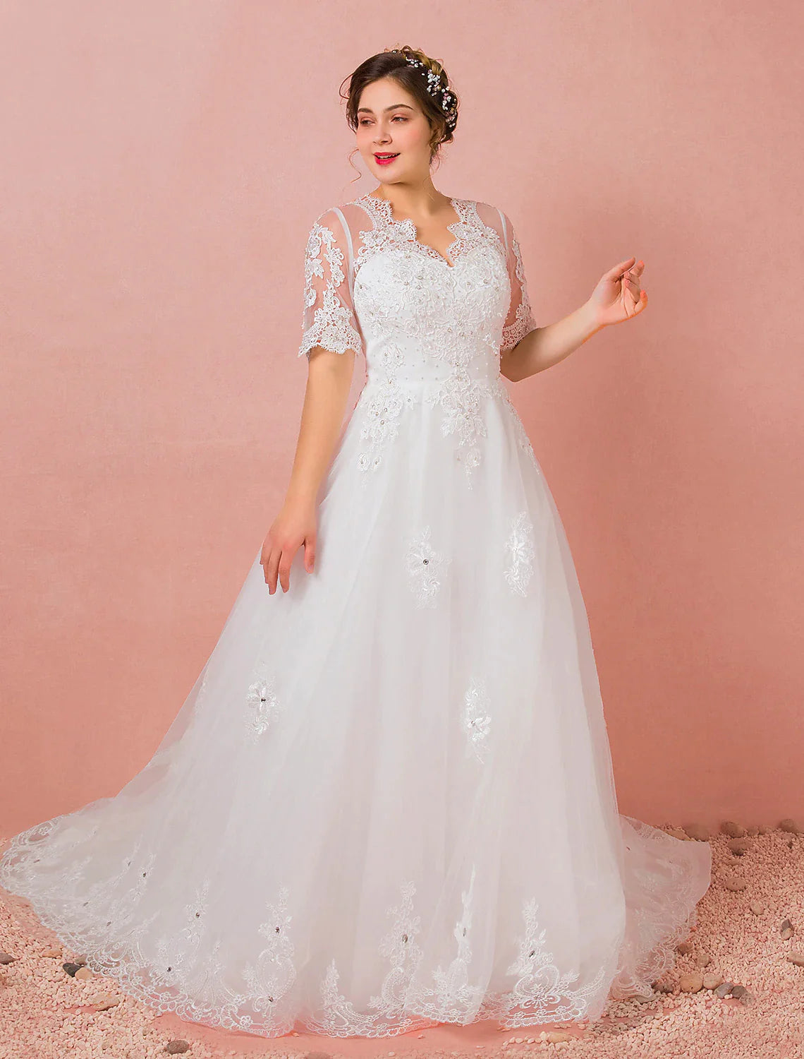 Full length view of the elegant A-Line bridal gown with half sleeves and a V-neck.