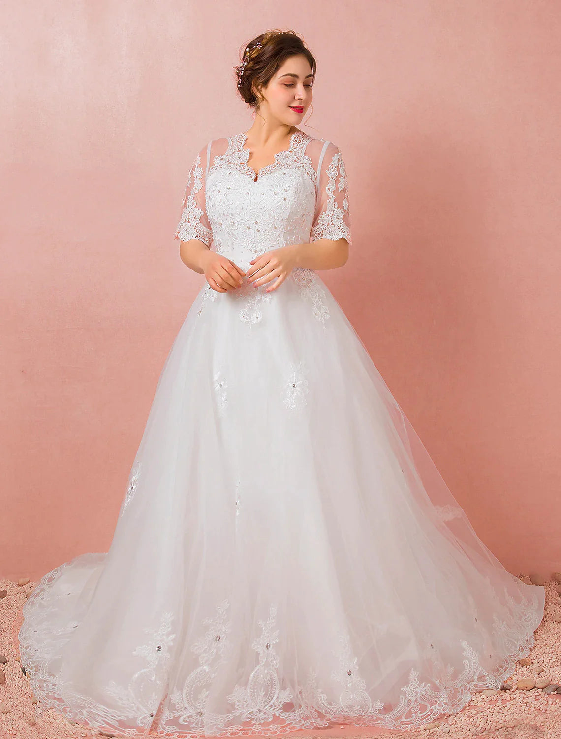 Model posing in the A-Line satin wedding dress, showing its full design.