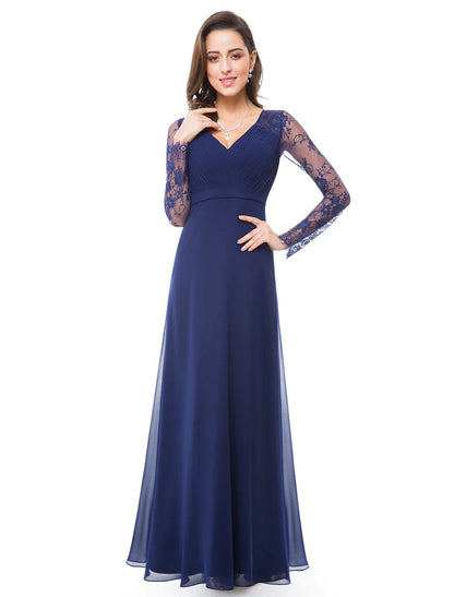 Woman posing in the elegant A-Line V-neck long sleeve chiffon gown.