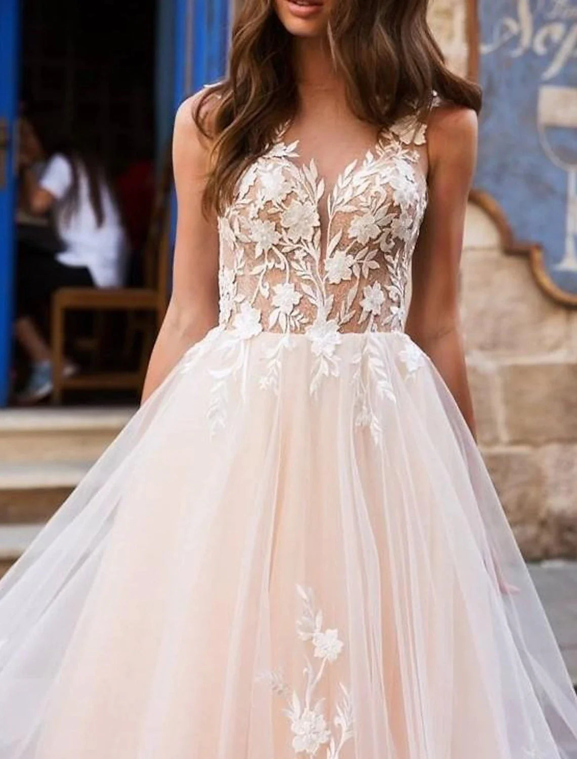 Back view of the wedding dress, showcasing the elegant open back and court train.