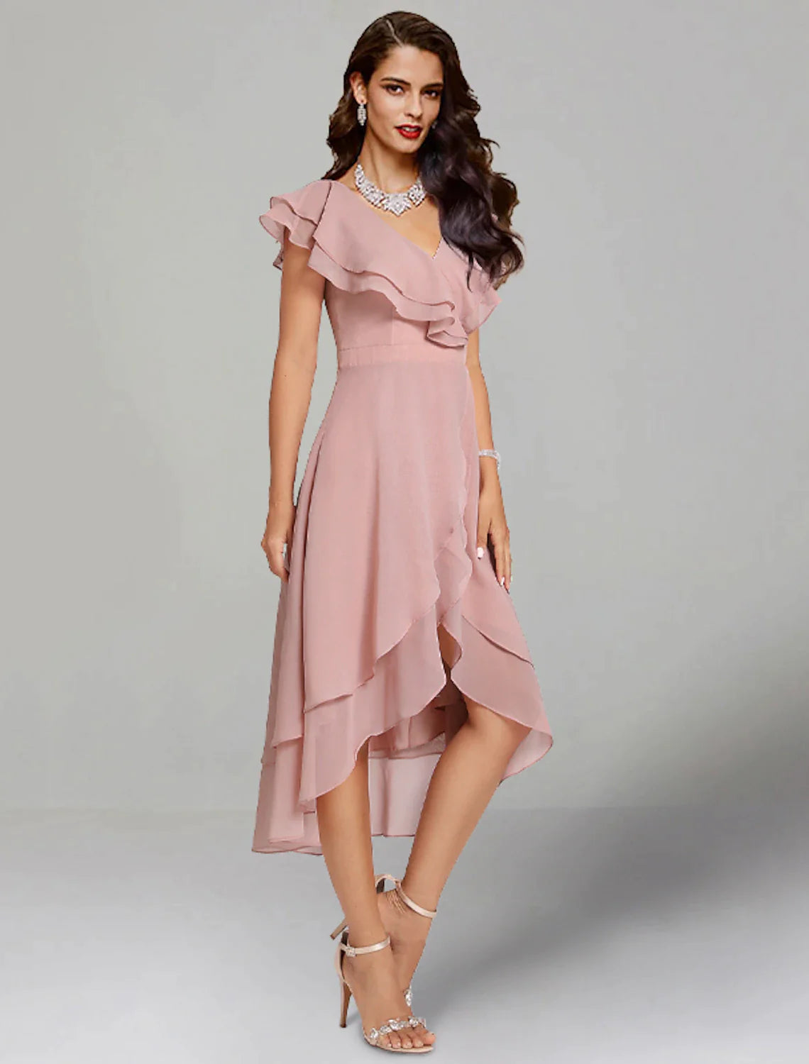 Back view of a woman in the A-line V-neck short sleeve chiffon tea length dress.