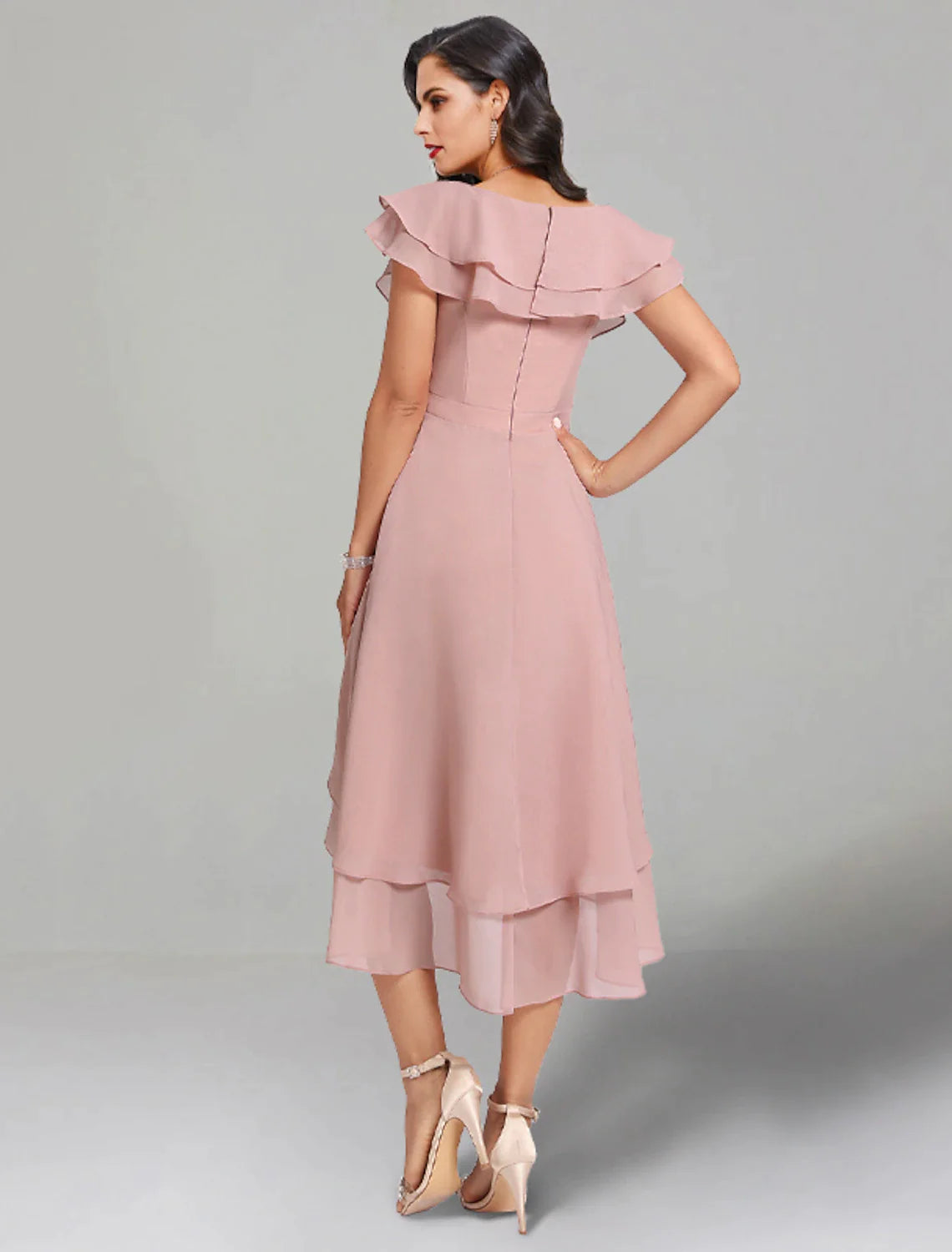 Detail of the V-neckline and chiffon fabric on the elegant tea length dress.