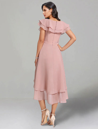 Detail of the V-neckline and chiffon fabric on the elegant tea length dress.