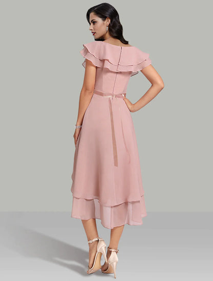 Side view of a flowing chiffon A-Line dress with tiered skirt.