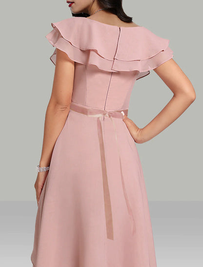 Back view of the tea-length wedding guest dress with V-neckline.