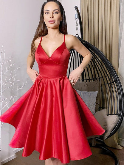 Side profile of a V-neck sleeveless mini dress in satin.