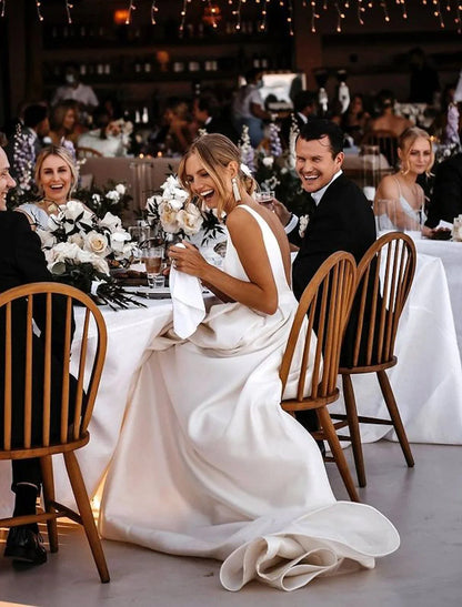 Full length view of A-line wedding dress with flowing court train.
