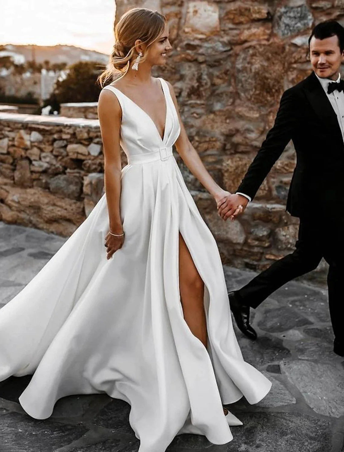 Elegant A-line bridal gown with V-neck and court train.