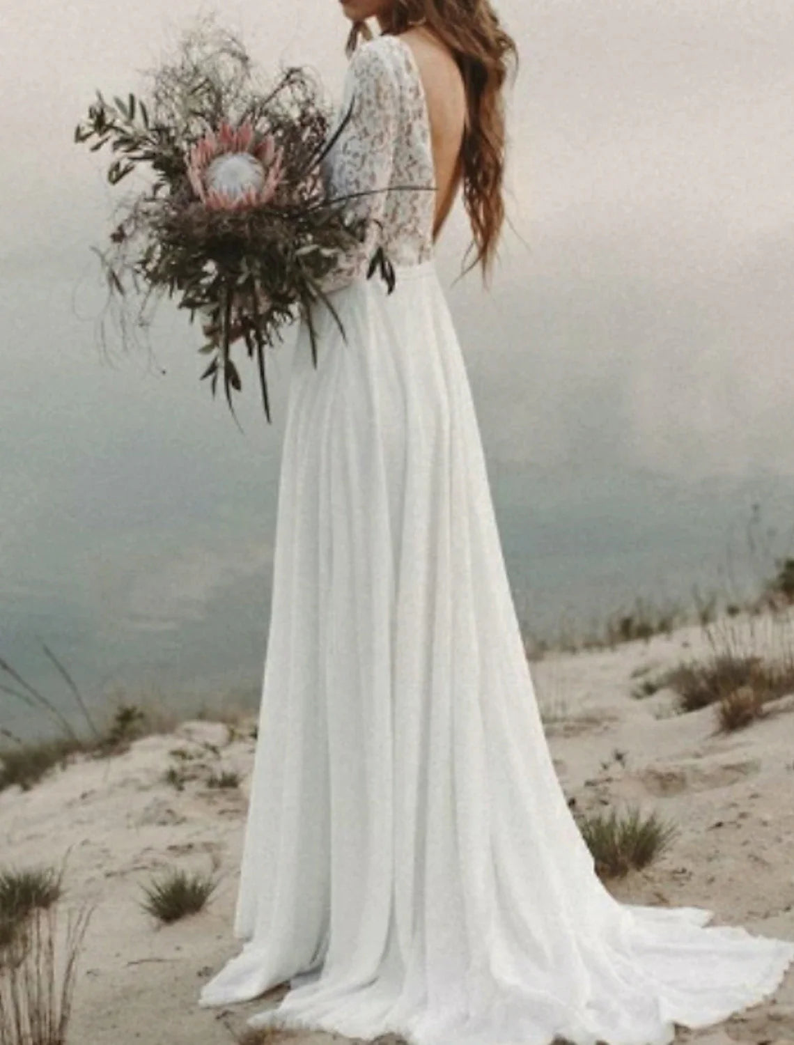 Back view of the A-line chiffon wedding dress, showcasing the elegant sweep train.