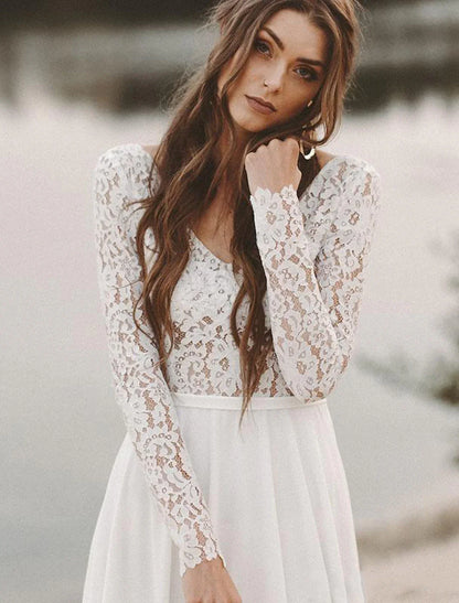 Side profile of a bride wearing the elegant long-sleeve chiffon bridal gown.