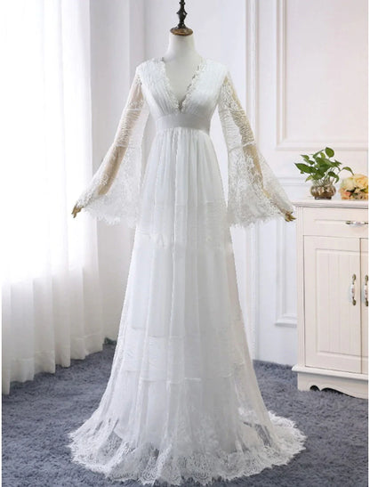 Full view of a bride wearing an elegant Boho A-line V-neck long sleeve lace wedding dress.