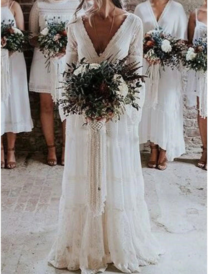 Back view of the elegant A-line bridal gown with intricate lace accents.