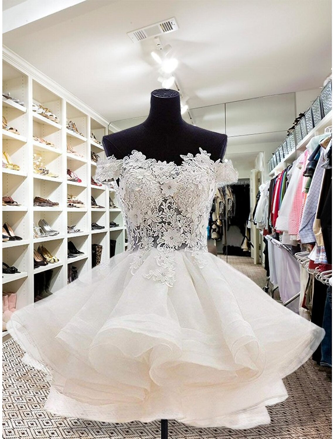 Front view of a short floral organza mini homecoming dress with appliques and buttons.