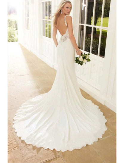 Open back and chapel train detail of a bridal gown.