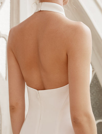 Woman walking in a casual court train bridal shower dress.