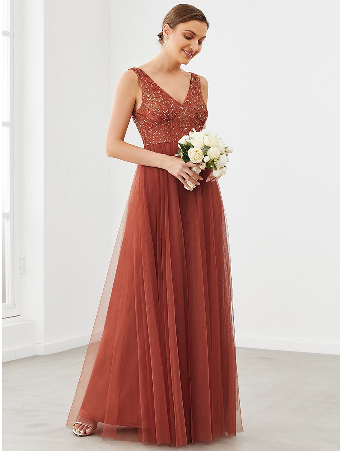 Back view of a light blue A-line floor-length homecoming dress.