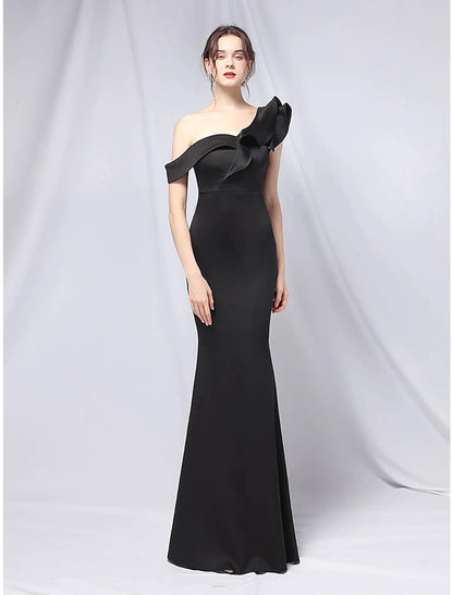 Side view of a stretch satin mermaid gown, highlighting the ruffled skirt.