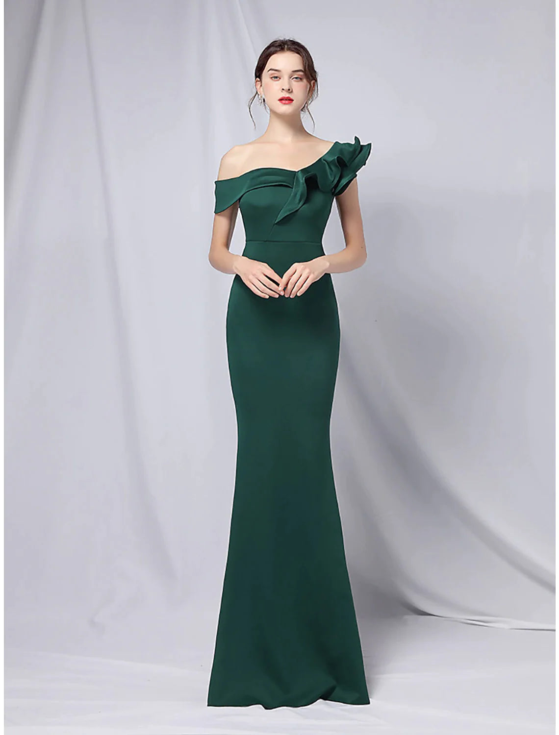 Back view of the floor-length evening dress with a subtle train.