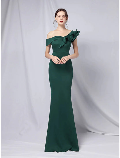 Back view of the floor-length evening dress with a subtle train.