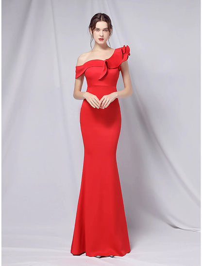 Close-up of the one-shoulder neckline and ruffled detail on the gown.